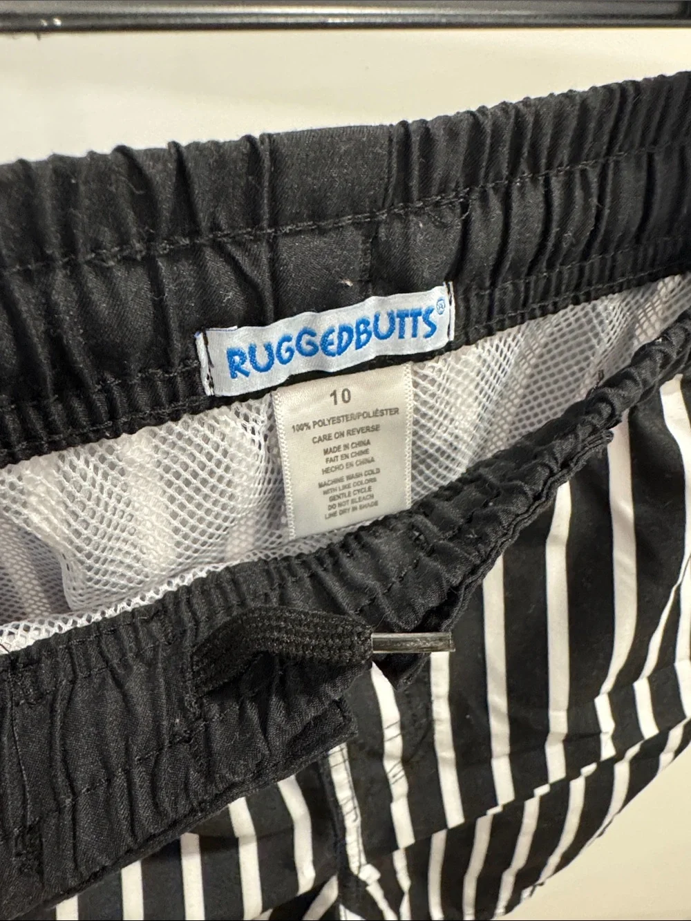 RuggedButts Boys black and white striped swim trunks